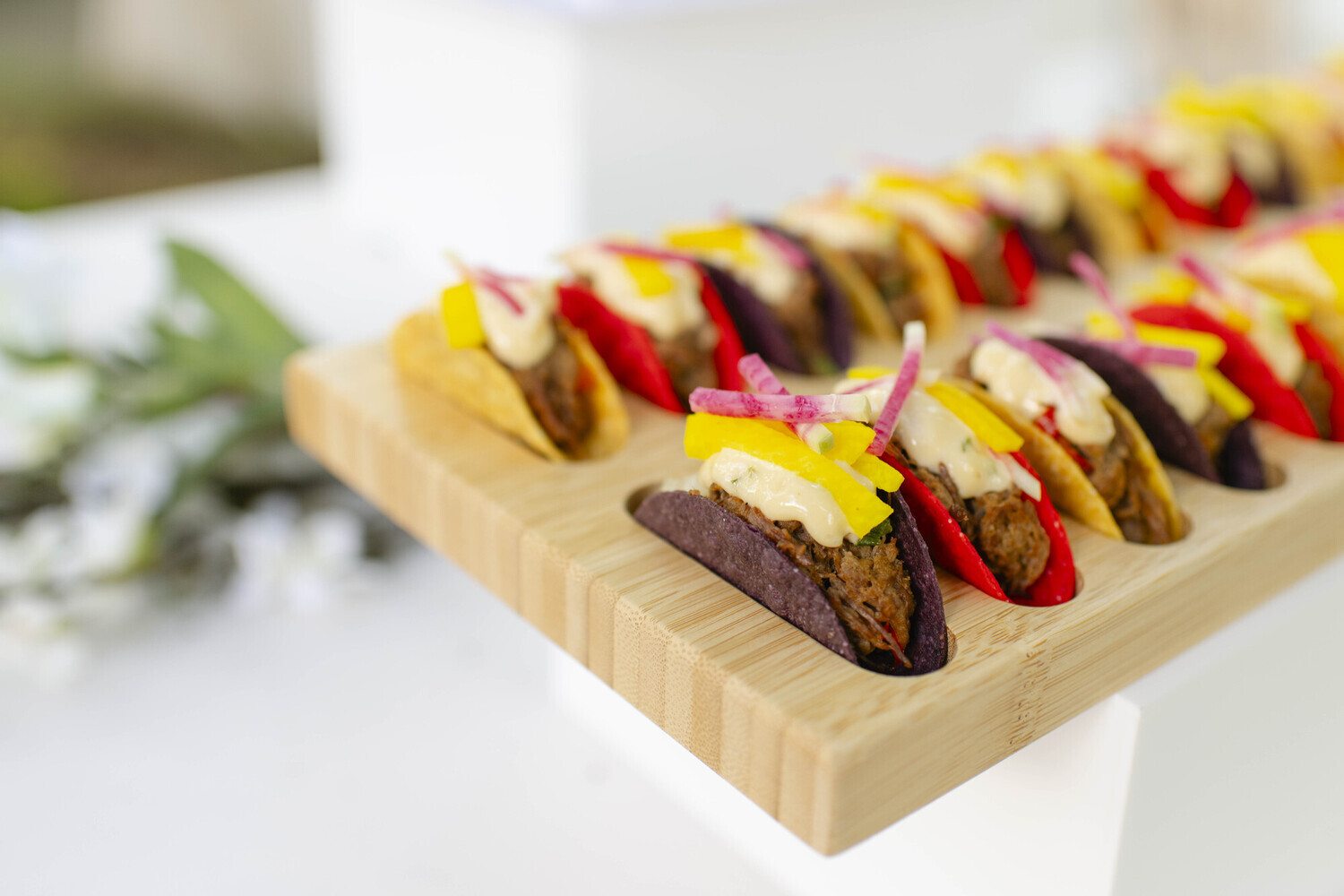 Applewood roasted duck taco with pasilla lime aioli and pickled jicama slaw from a custom Boston catering menu.