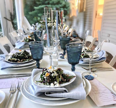 Gourmet brunch table in Boston set with smoked salmon, pastries, and fruit, styled by Johnny Burke Catering.