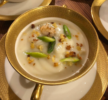 Cauliflower bisque with croquette, asparagus, and bulgur served at an elegant Boston brunch.