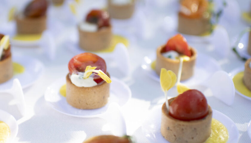 Heirloom Tomato & Whipped Ricotta Tartlet with Sienna Farms Corn Puree and Fresh Herbs, served at a rehearsal dinner.
